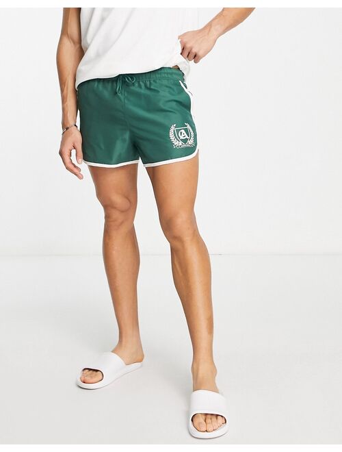 ASOS DESIGN runner swim shorts in super short length with placement print in khaki