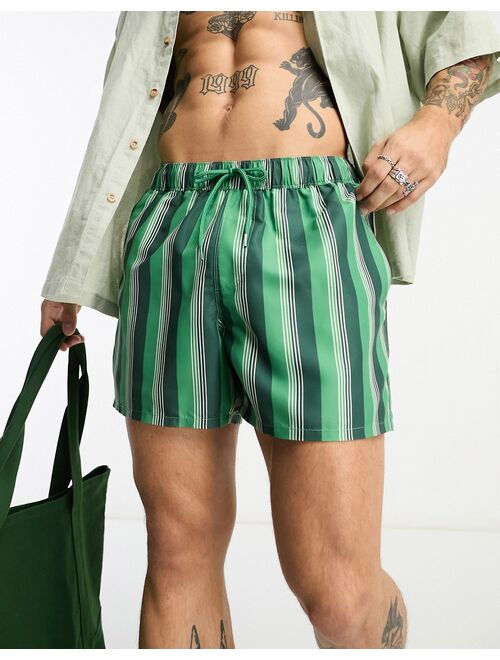 ASOS DESIGN swim shorts in short length in green stripe