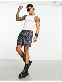 swim shorts in mid length in bandana print