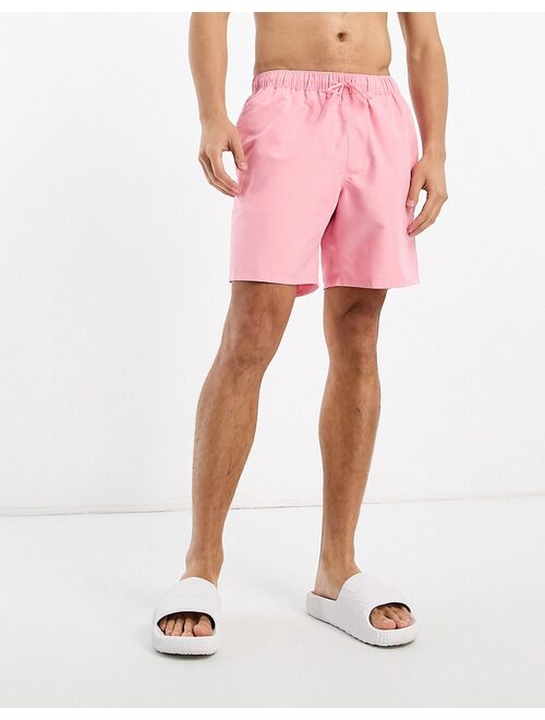 ASOS DESIGN swim shorts in mid length in pink