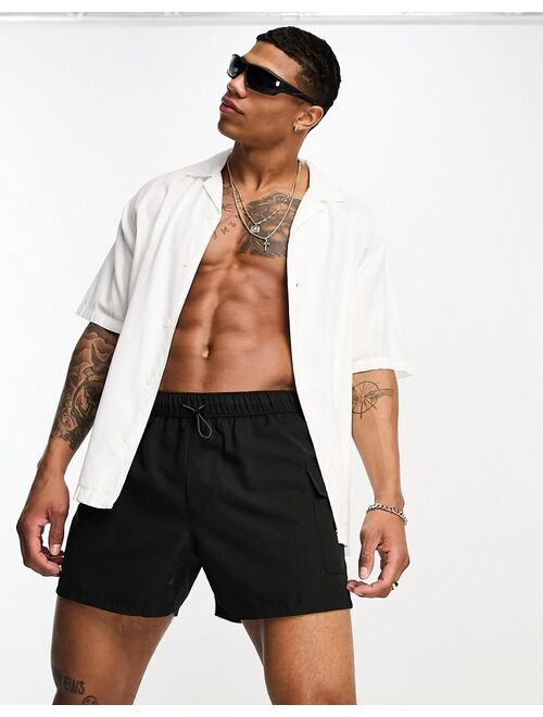 ASOS DESIGN swim shorts in short length with cargo pockets in black