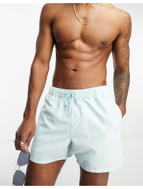 ASOS DESIGN swim shorts in short length in blue