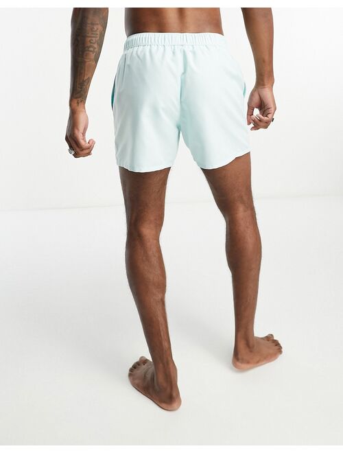 ASOS DESIGN swim shorts in short length in blue