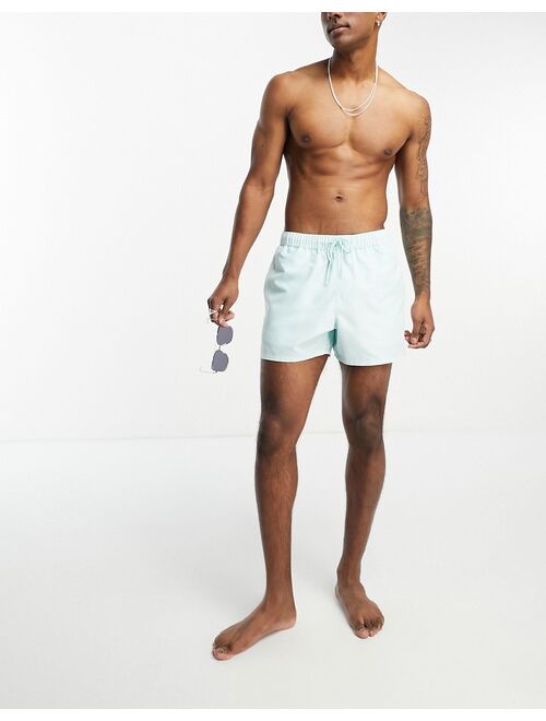 ASOS DESIGN swim shorts in short length in blue