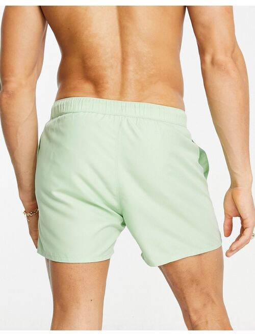 ASOS DESIGN swim shorts in short length in light green