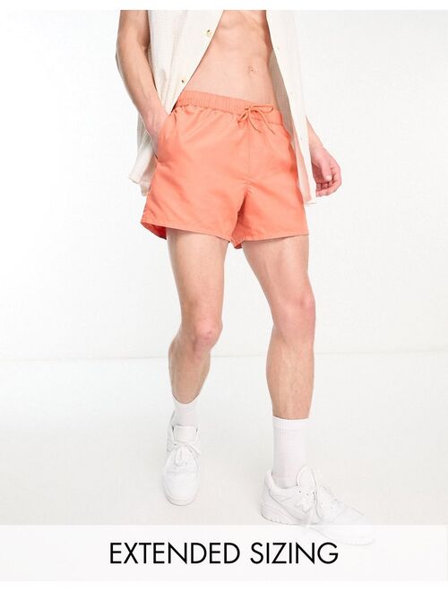 ASOS DESIGN swim shorts in short length in orange