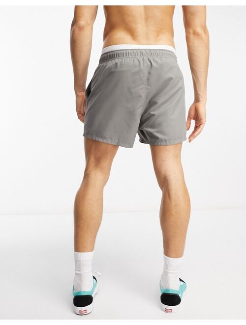 ASOS DESIGN swim shorts in short length with contrast waistband in charcoal