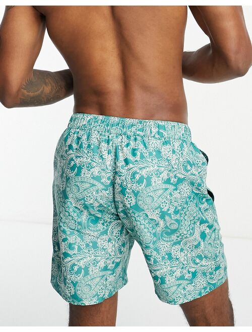 ASOS DESIGN swim shorts in short length in floral print in green