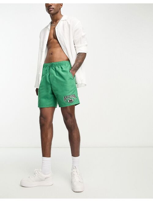 ASOS DESIGN swim shorts in short length with 'Arizona' print in green