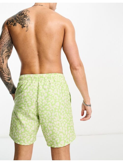 ASOS DESIGN swim shorts in short length in leopard print in green