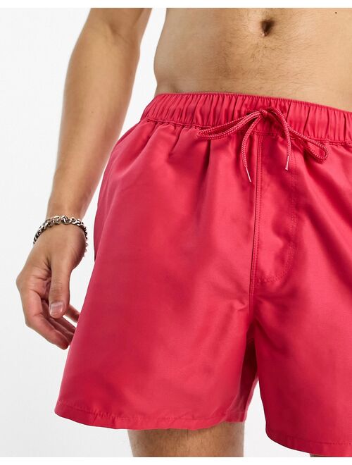 ASOS DESIGN swim shorts in short length in pink