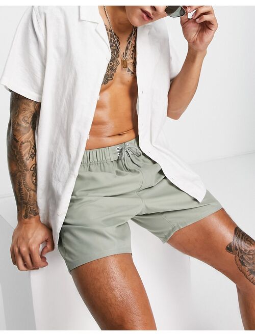 ASOS DESIGN swim shorts in mid length in light khaki