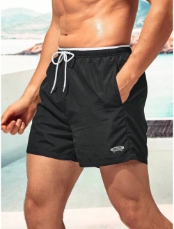 Men Letter Graphic Drawstring Waist Swim Trunks