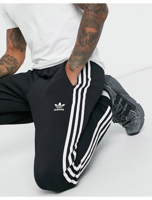 adidas Originals adicolor three stripe skinny sweatpants in black