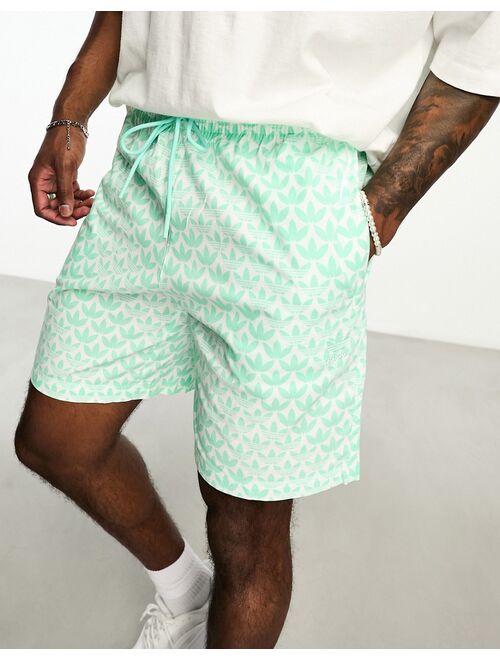 adidas Originals Monogram AOP shorts in green