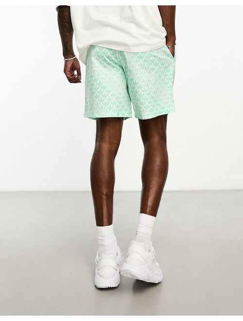 adidas Originals Monogram AOP shorts in green