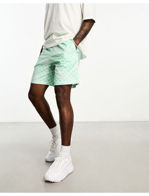 adidas Originals Monogram AOP shorts in green