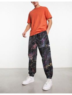 nylon utility trail glow print sweatpants in black