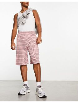 festival textured baggy skater short in pink plaid