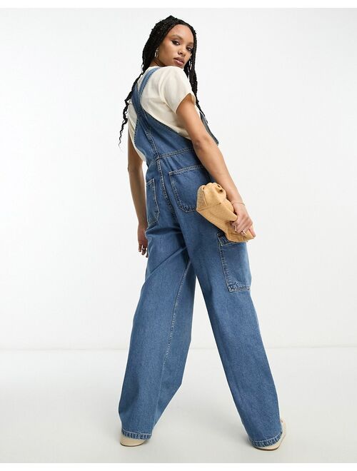 ASOS DESIGN denim cargo overalls in mid blue