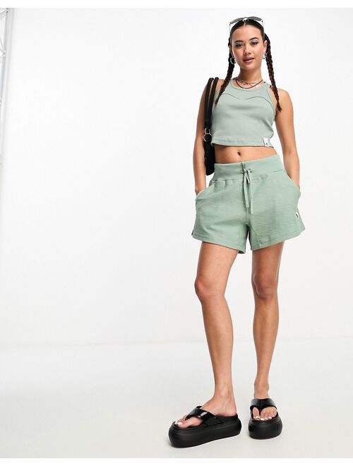 adidas performance adidas Lounge long shorts in green