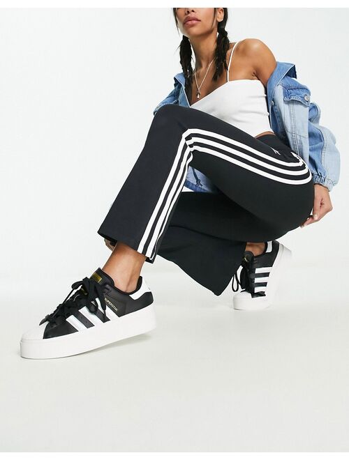 adidas Originals 3-Stripes cropped flare leggings in black