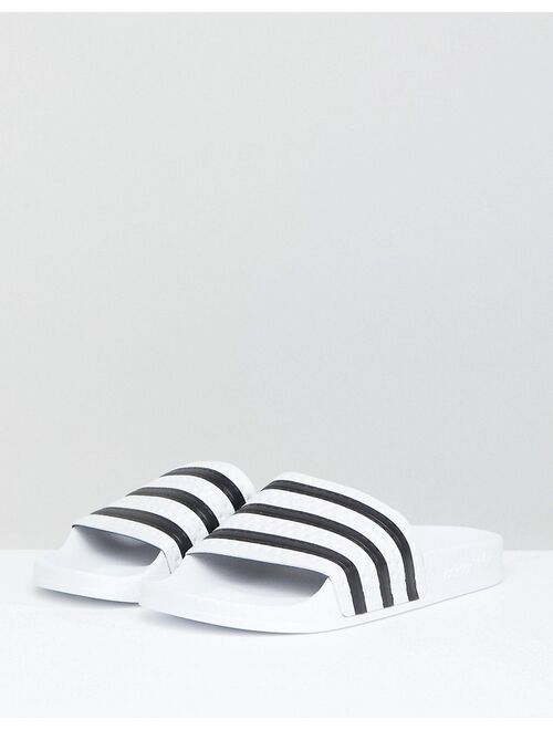 adidas Originals adilette sliders in white and black