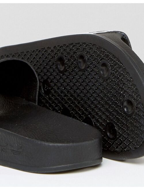 adidas Originals adilette sliders in black and white