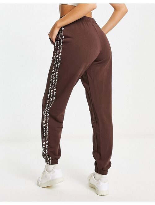 adidas Originals Animal Abstract sweatpants in brown