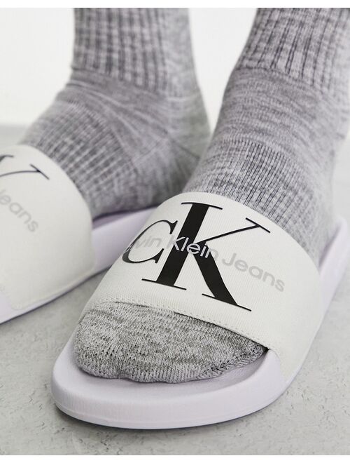 Calvin Klein Jeans monogram sliders in white