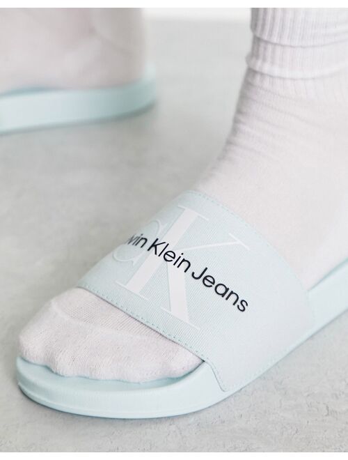 Calvin Klein Jeans monogram sliders in light blue