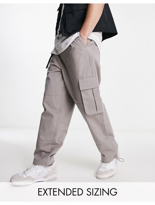 ASOS DESIGN oversized tapered cargo pants in beige with belt