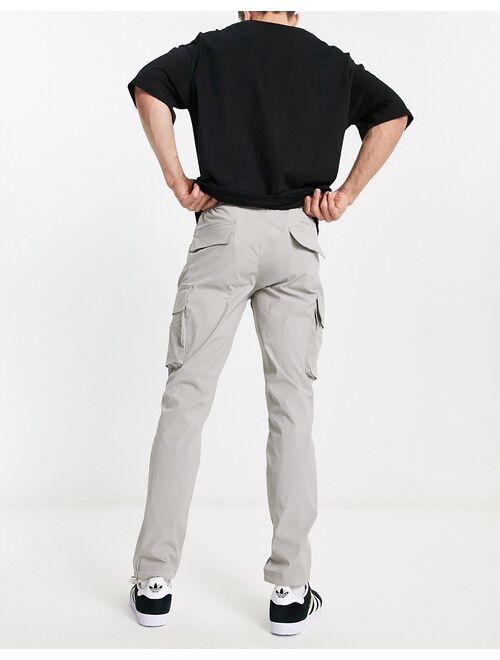 ADPT technical cargo pants in gray