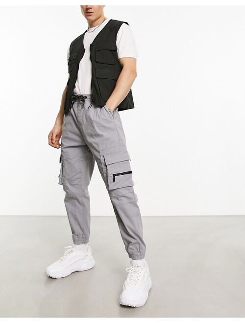 Bershka pocket cargo sweatpants in gray exclusive to ASOS