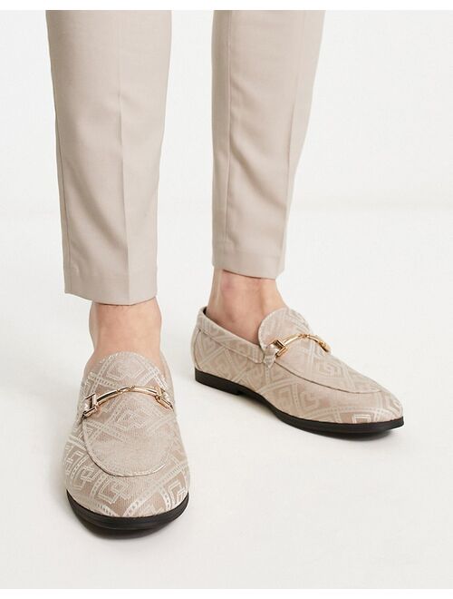 ASOS DESIGN loafers in brown monogram design with gold snaffle