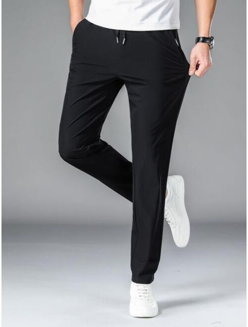 Men Drawstring Waist Slant Pocket Pants