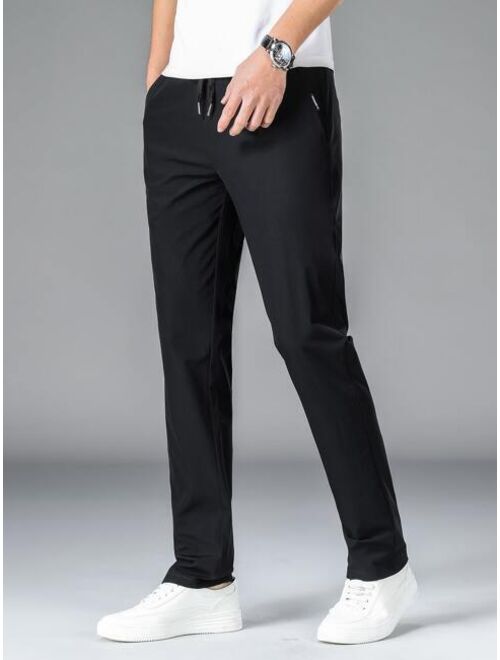 Men Drawstring Waist Slant Pocket Pants