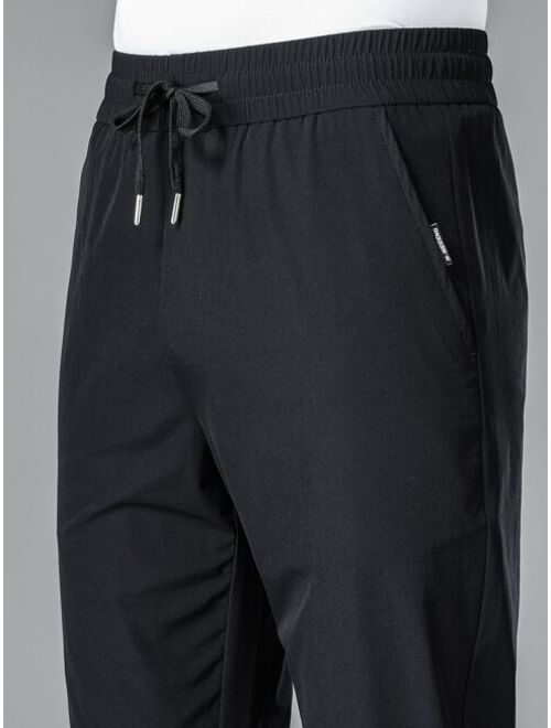 Men Drawstring Waist Slant Pocket Pants