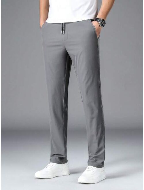 Men Drawstring Waist Slant Pocket Pants