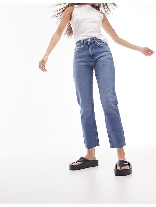 Topshop mid rise straight jeans with raw hem in mid blue