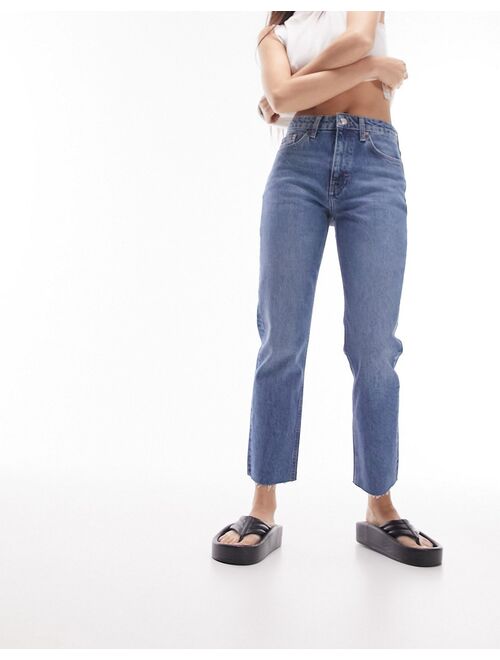 Topshop mid rise straight jeans with raw hem in mid blue