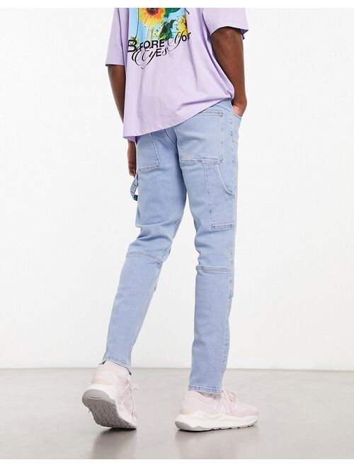 ASOS DESIGN slim jeans with carpenter detail in light wash blue