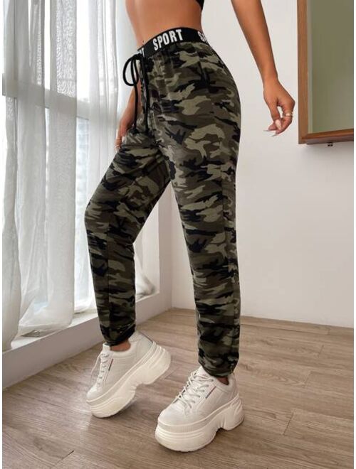 SHEIN EZwear Camo Print Knot Front Letter Tape Sweatpants