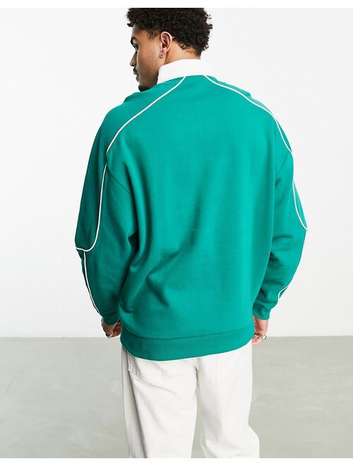 ASOS DESIGN oversized rugby sweatshirt with piping in green