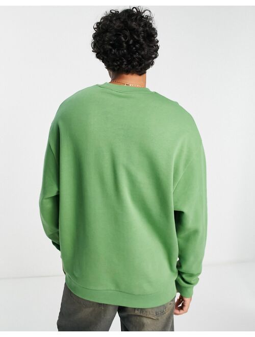 Crooked Tongues oversized sweatshirt with chillin' toad graphic print in green