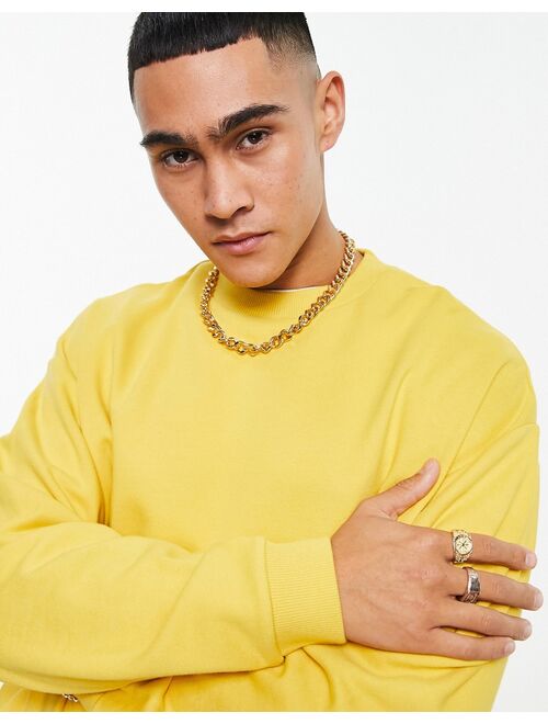 ASOS DESIGN oversized sweatshirt in yellow