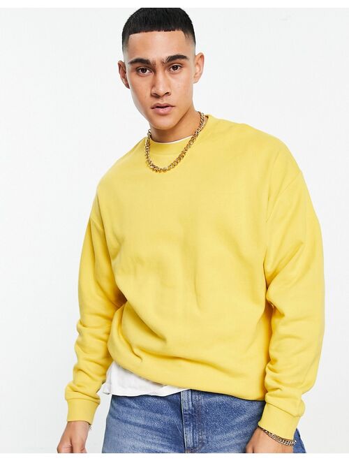 ASOS DESIGN oversized sweatshirt in yellow