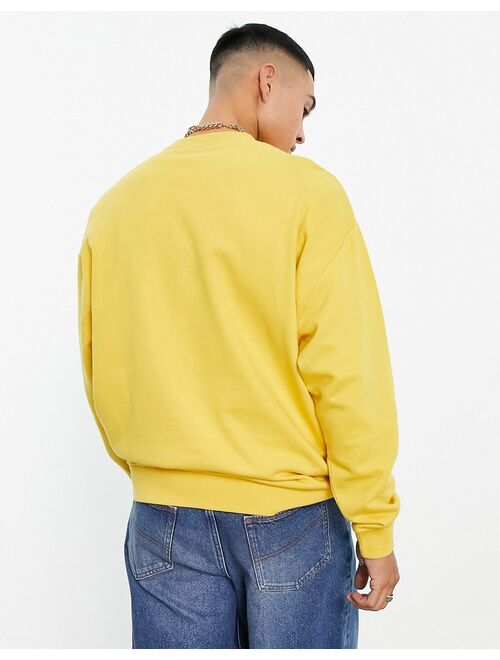 ASOS DESIGN oversized sweatshirt in yellow