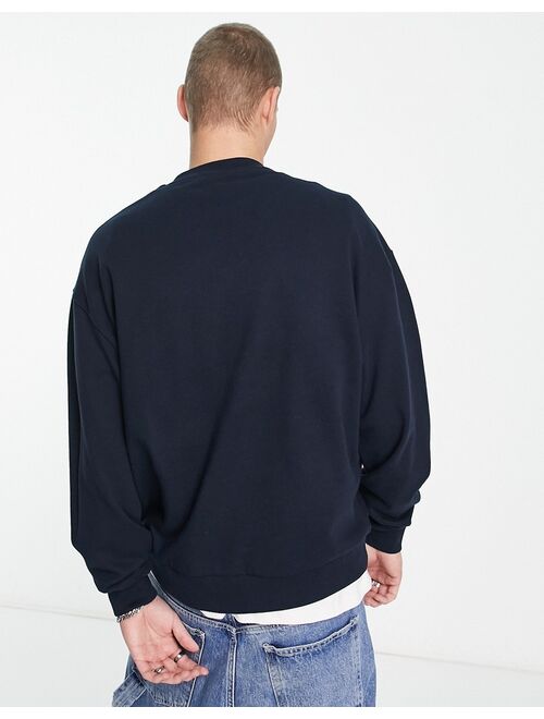 ASOS DESIGN oversized sweatshirt in navy with souvenir sketch front print