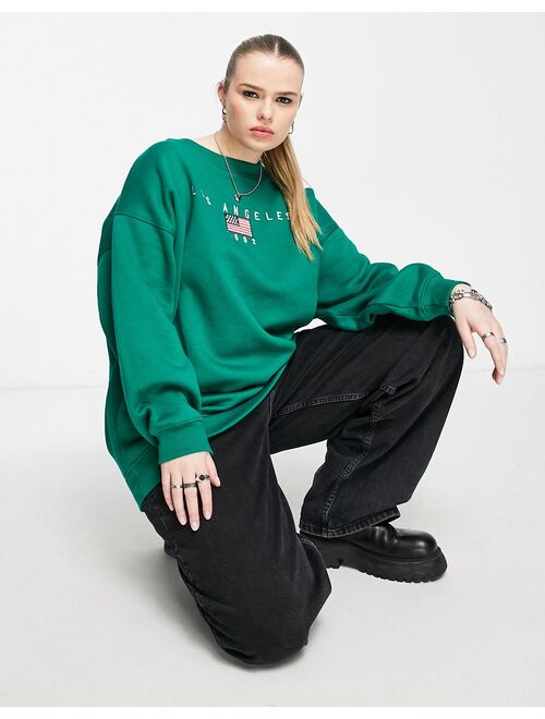 Daisy Street Plus relaxed sweatshirt with LA graphic in green